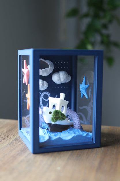 Jumping spider enclosure with marine-themed decorations showing boat and kraken design, fully 3D printed.