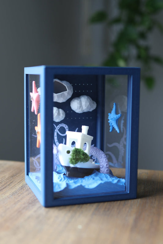 Jumping spider enclosure with marine-themed decorations showing boat and kraken design, fully 3D printed.