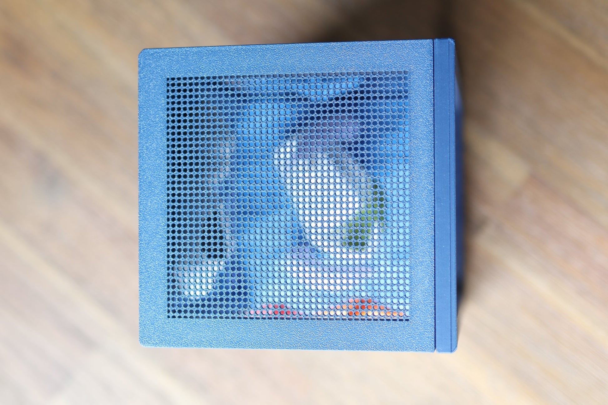 Top grid and side ventilation holes on a marine-themed jumping spider enclosure for airflow.